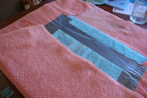 I trimmed the corners of the towels for a smoother cover.